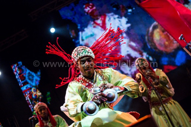 Gnaoua a musician during his performance playing the typical Krakebs