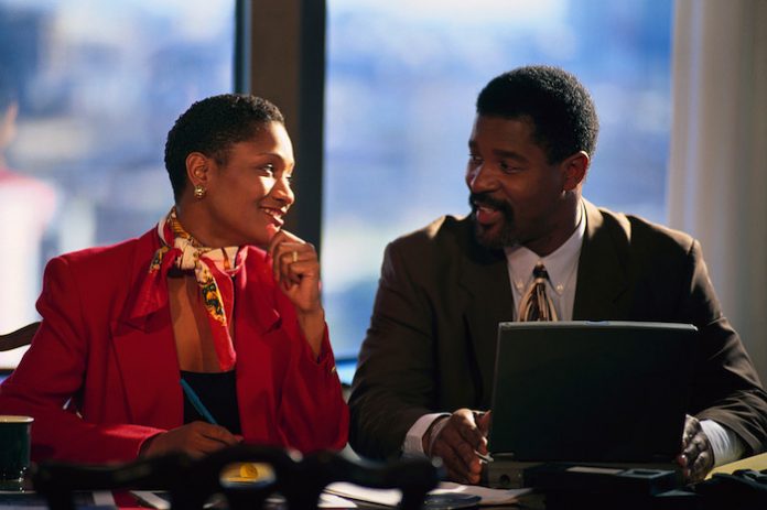 Businesspeople Working on Laptop