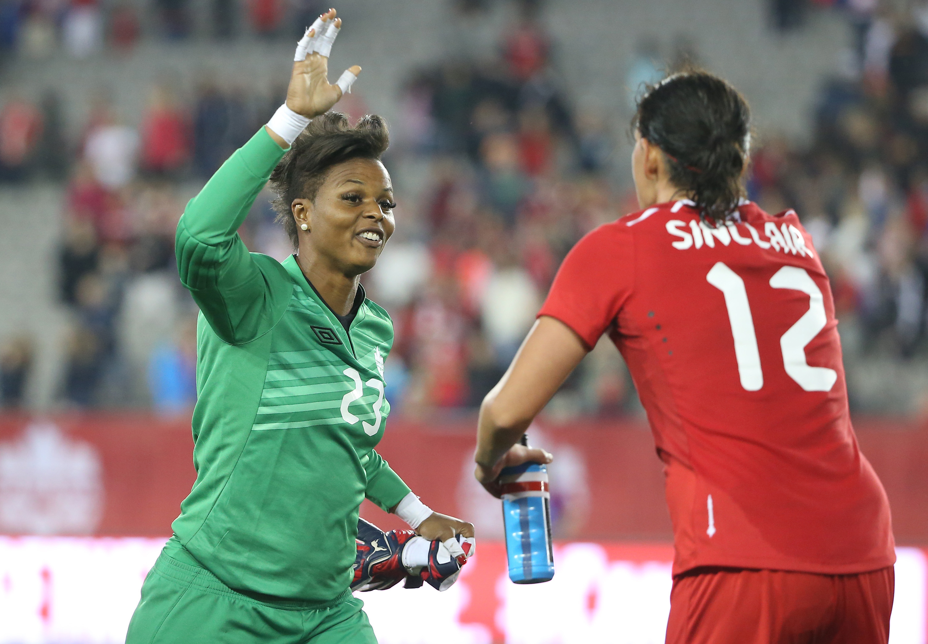 HAMILTON, CANADA - MAY 29: Karina LeBlanc #23 of Canada celebrates their victory with Christine Sinclair #12 against England during their Women's International Friendly match on May 29, 2015 at Tim Hortons Field in Hamilton, Ontario, Canada. (Photo by Tom Szczerbowski/Getty Images)