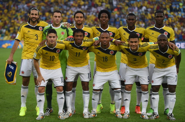 Members of Colombia's national team(Back row L-R) Colombia's defender and captain Mario Alberto Yepes, Colombia's goalkeeper David Ospina, Colombia's midfielder Abel Aguilar, Colombia's midfielder Carlos Sanchez, Colombia's forward Jackson Martinez and Colombia's defender Cristian Zapata (Front row L-R) Colombia's midfielder James Rodriguez, Colombia's midfielder Juan Guillermo Cuadrado, Colombia's defender Juan Camilo Zuniga, Colombia's forward Teofilo Gutierrez and Colombia's defender Pablo Armero  pose for the team photo prior to  the Round of 16 football match between Colombia and Uruguay at the Maracana Stadium in Rio de Janeiro during the 2014 FIFA World Cup in Brazil on June 28, 2014.   AFP PHOTO / EITAN ABRAMOVICHEITAN ABRAMOVICH/AFP/Getty Images